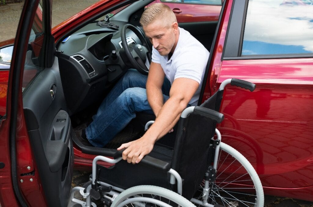 Handicapped Car Driver With A Wheelchair